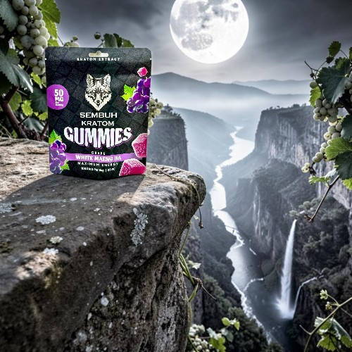 Gummies package in front of a scenic moonlit waterfall landscape.