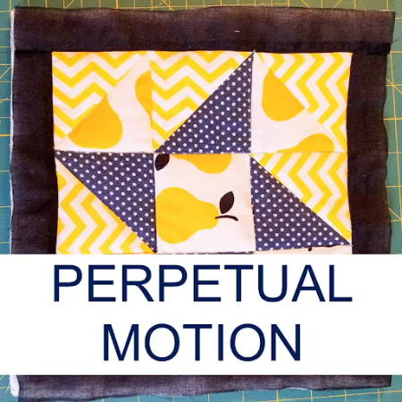 perpetual motion quilt block with yellow and blue fabrics