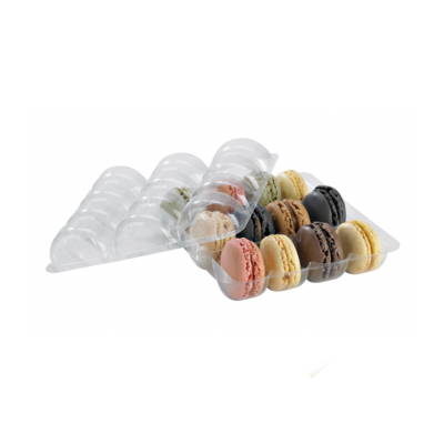 A clear insert for macarons with several macarons inserted