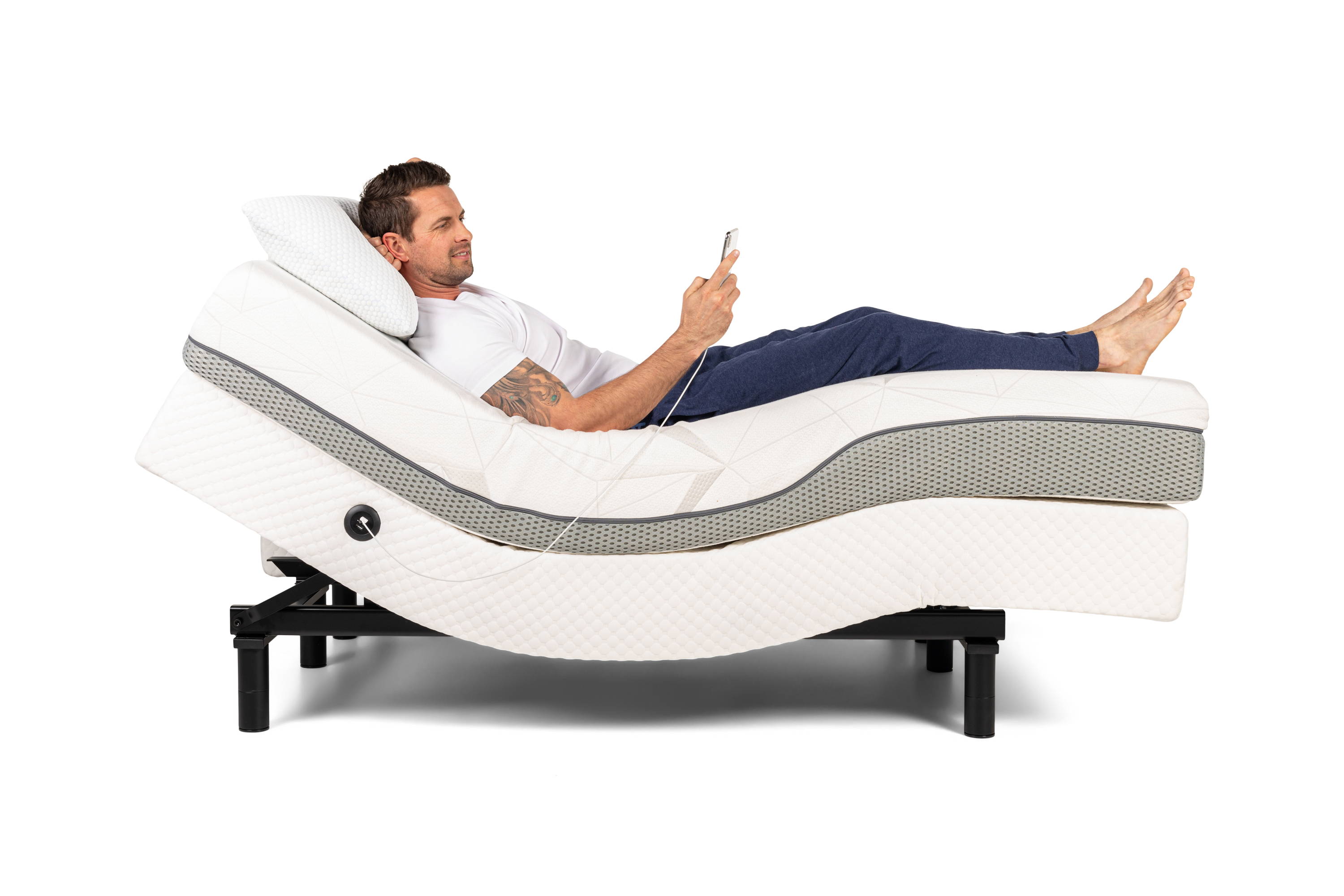Man lying in adjustable bed
