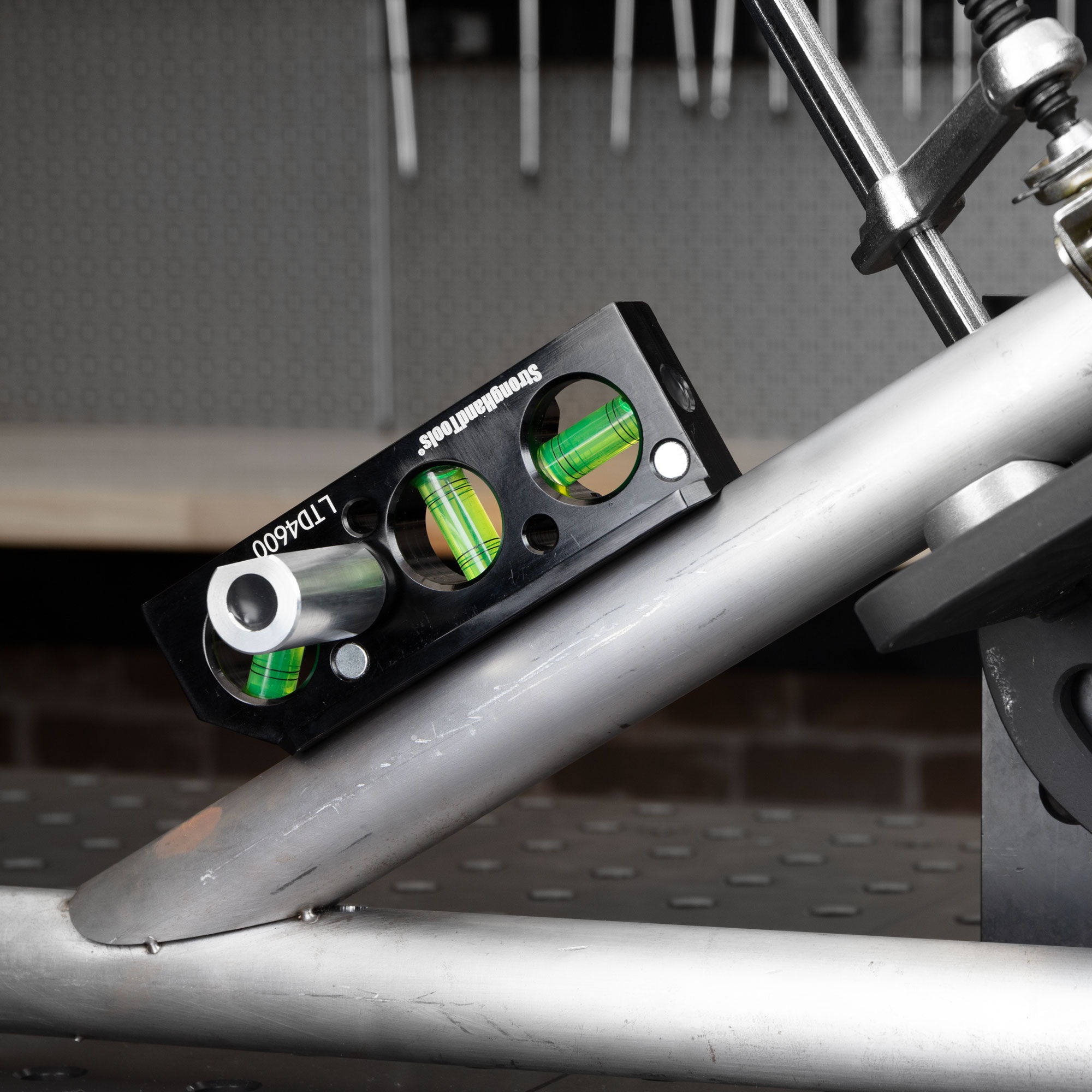 A close-up of a level tool resting on a metal surface.
