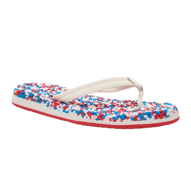 A colorful flip-flop with red, white, and blue speckles.