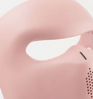 A close-up of a pink mask with unique design features.