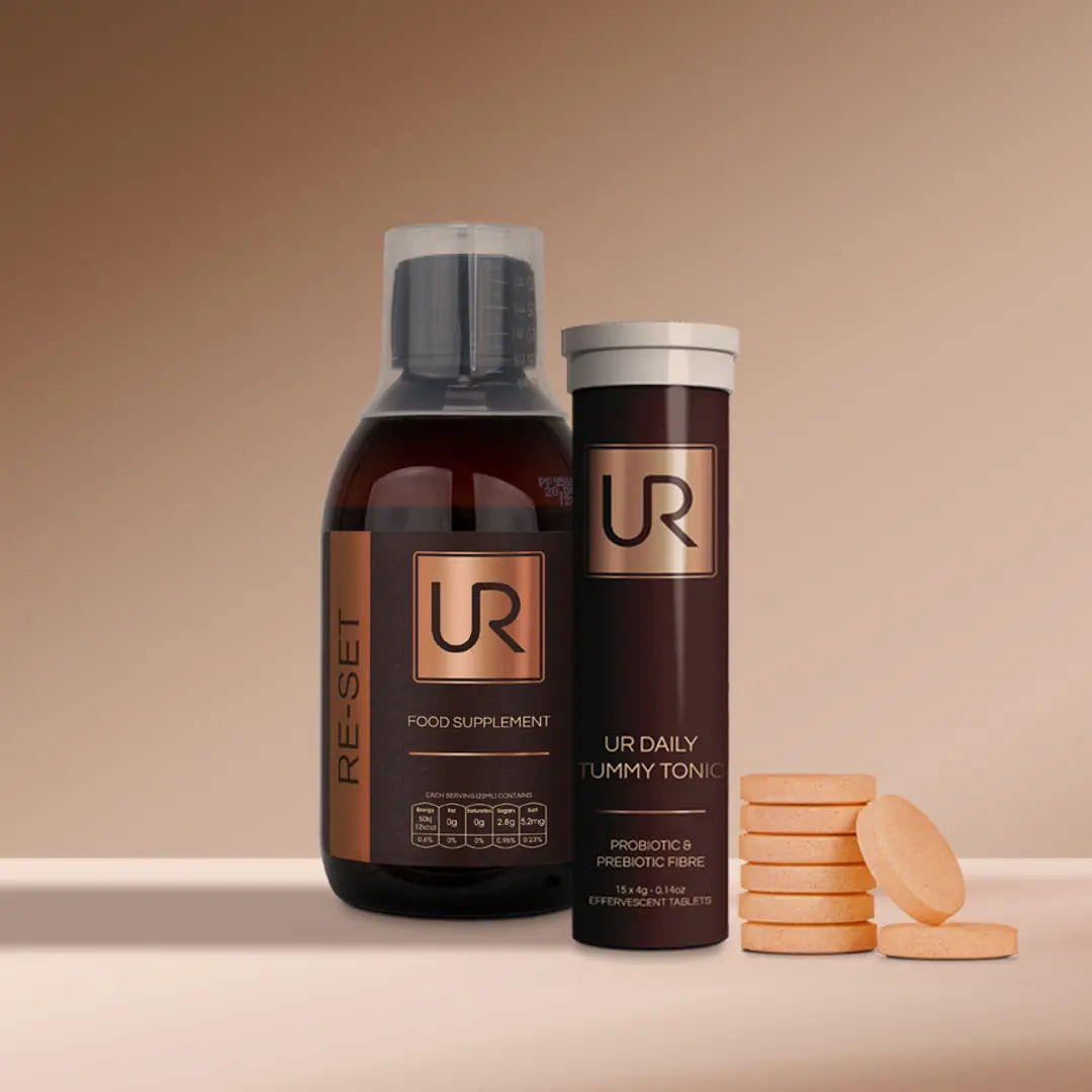 Urban Retreat gut health products with tablets on a neutral background.
