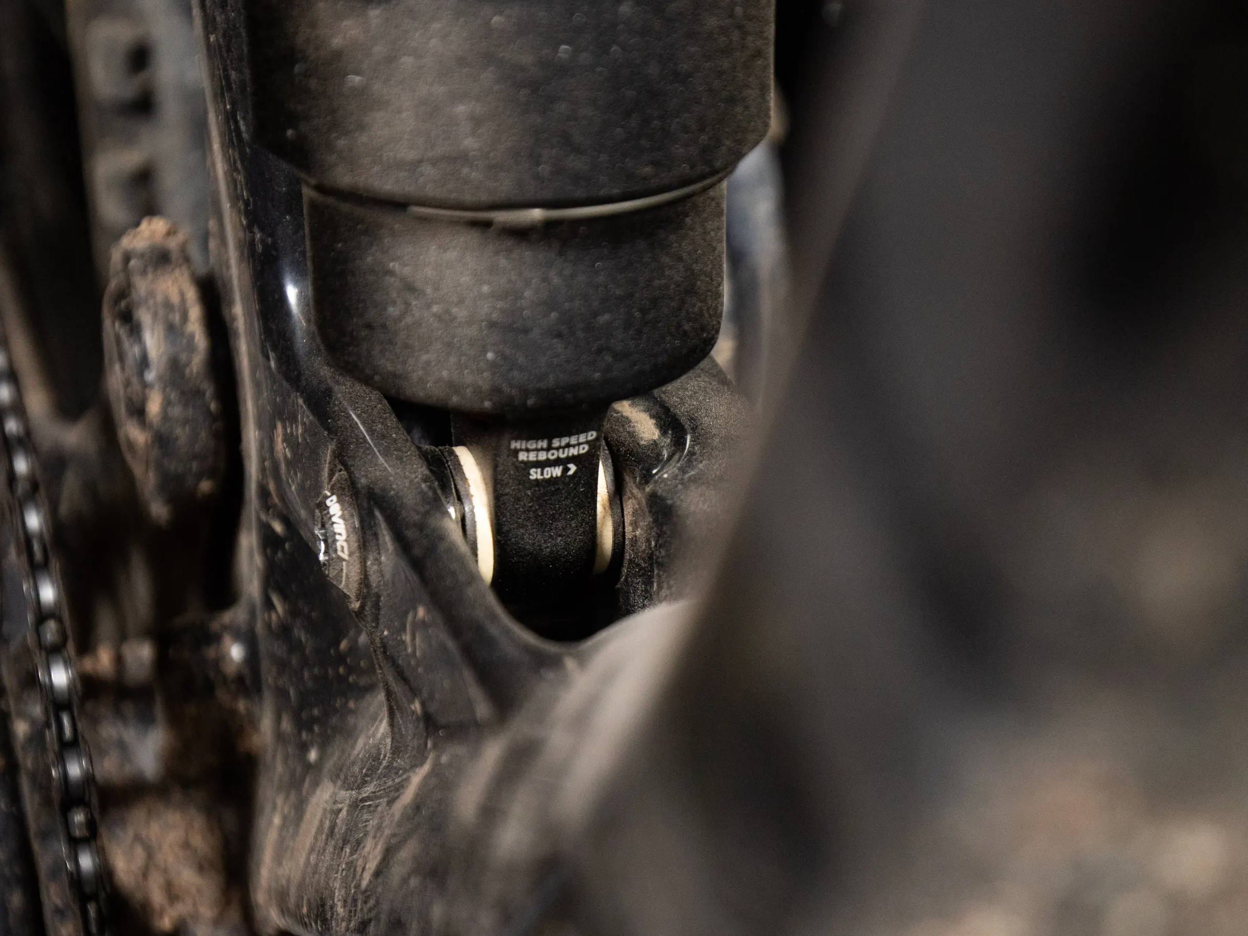 Detail of a Fox Float X2 mountain bike rear shock installed on a Devinco Spartan with mtb rear shock mounting hardware