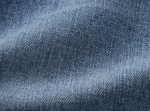 Close-up of textured blue denim fabric.