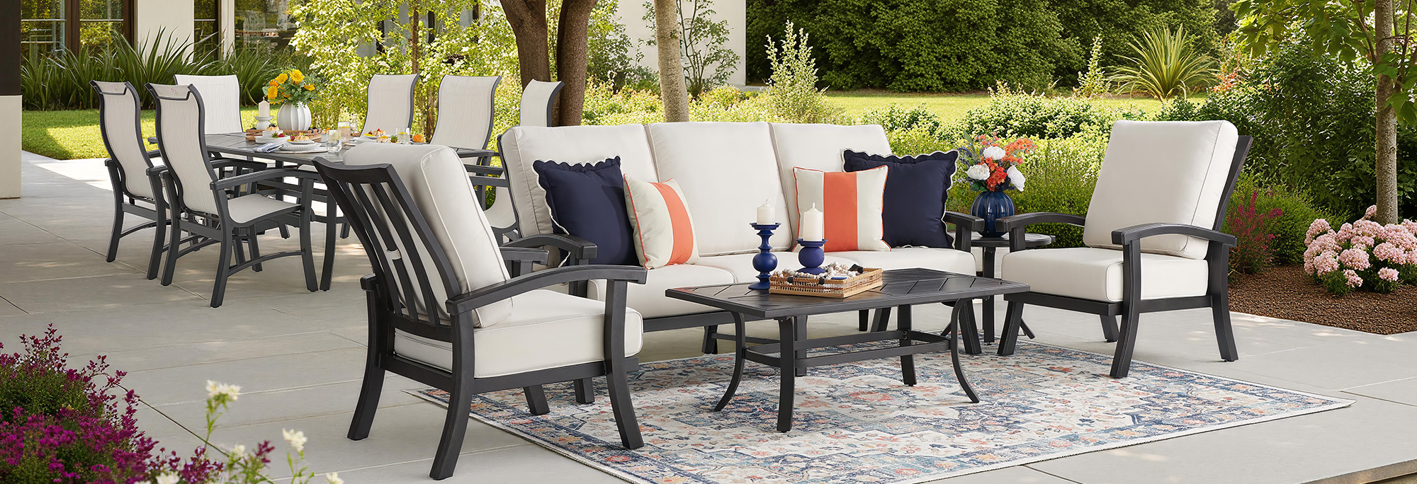 Outdoor seating area with plush cushions and a coffee table.