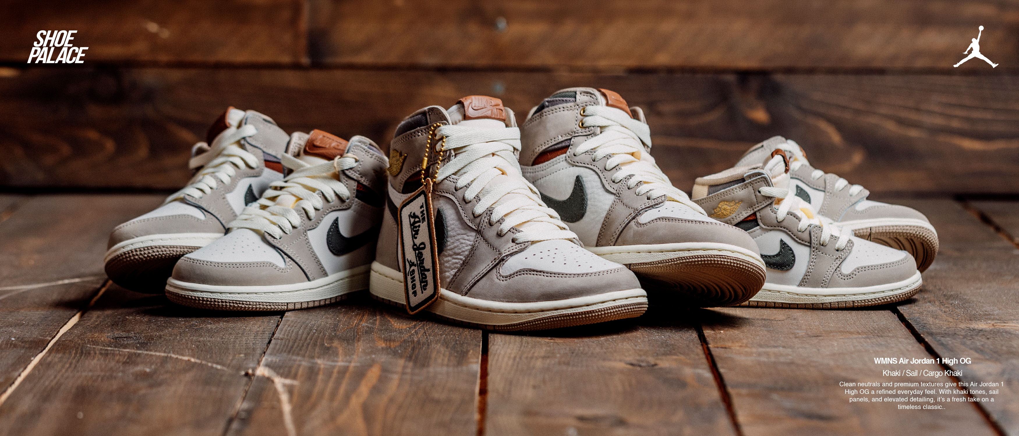 Four pairs of stylish sneakers on a wooden surface.