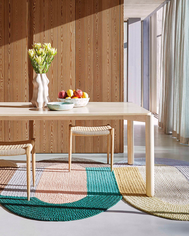 Colorful Trio Crochet Rug by GAN featuring stacked segments in various shades.