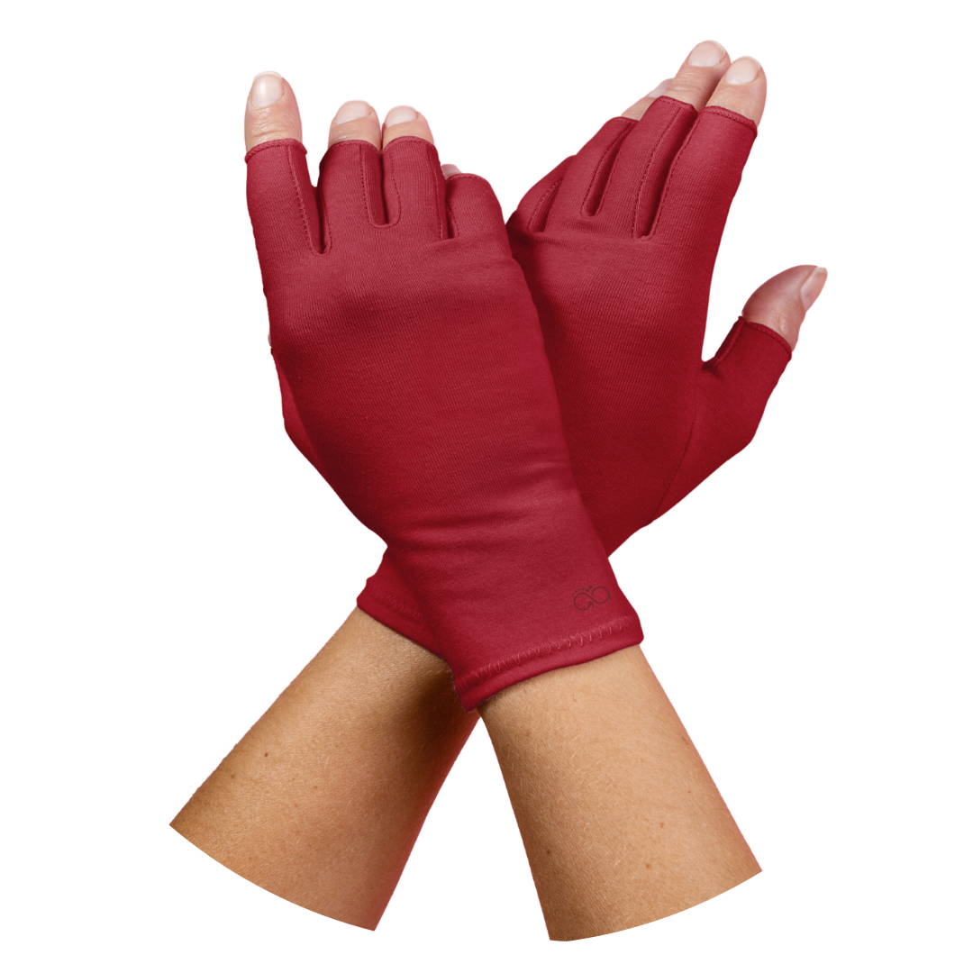 a womans hands, she has arthritis and is wearig Plum Purple compression gloves