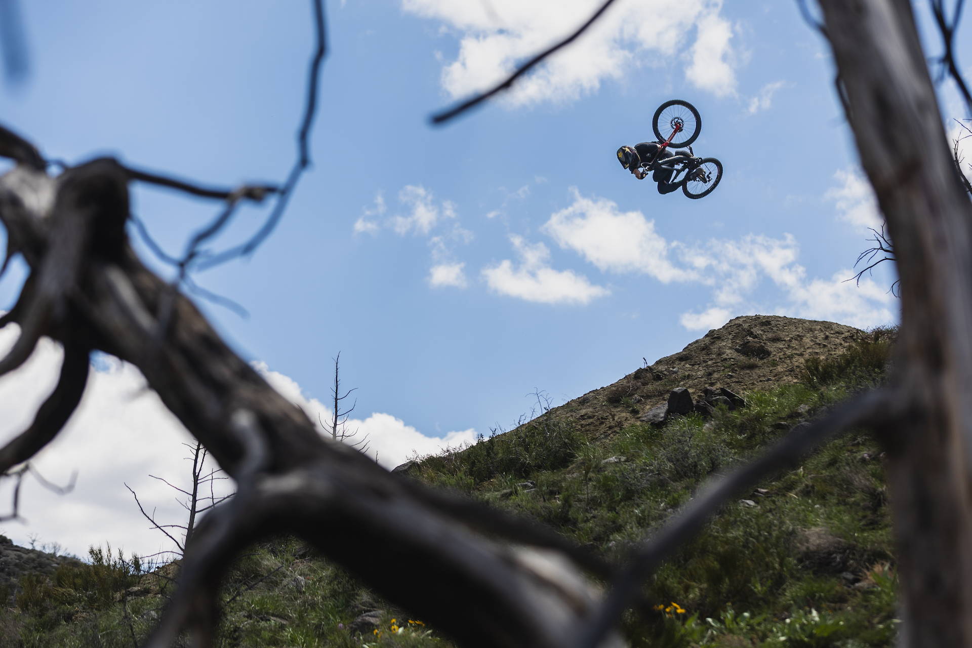 DJ Brandt hitting big features on his Nukeproof Dissent downhill bike