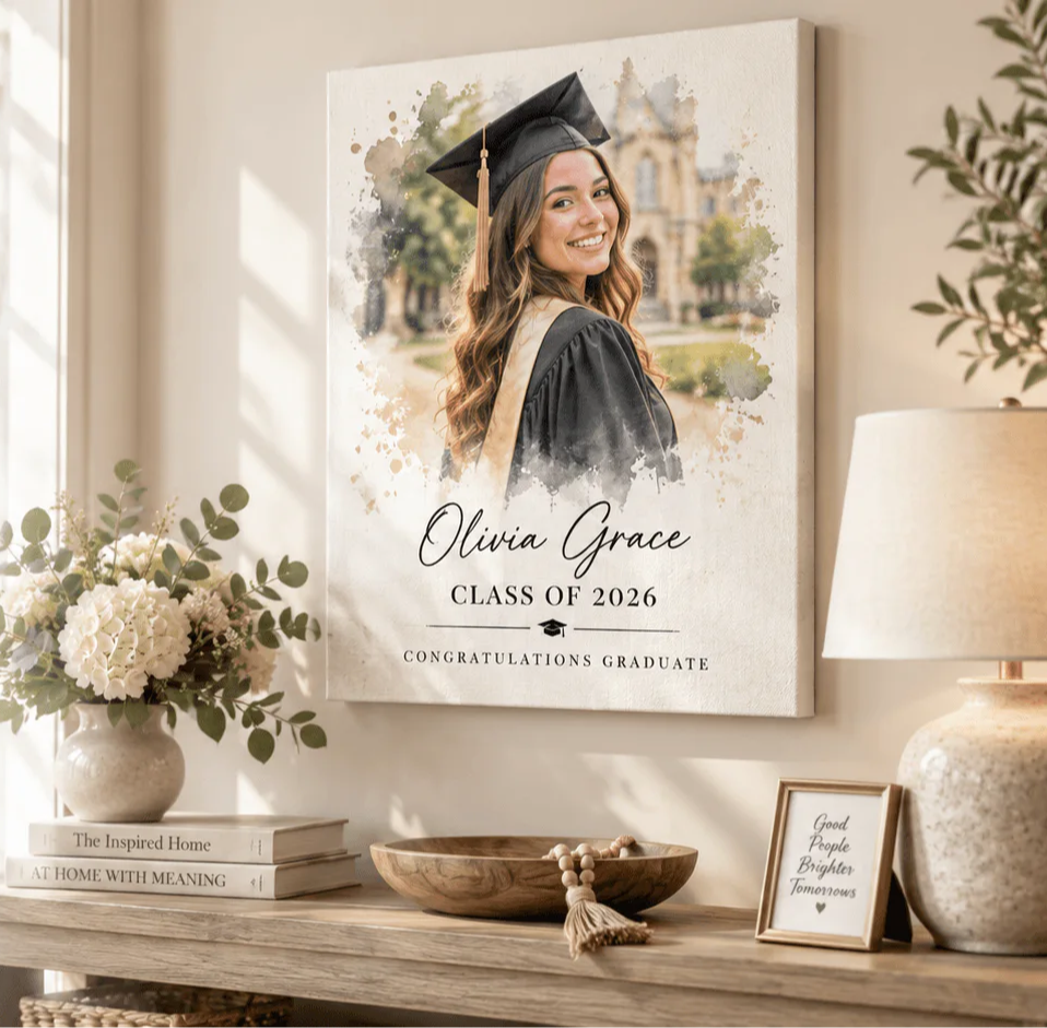 A graduation photo display on a wooden table with decorative elements.