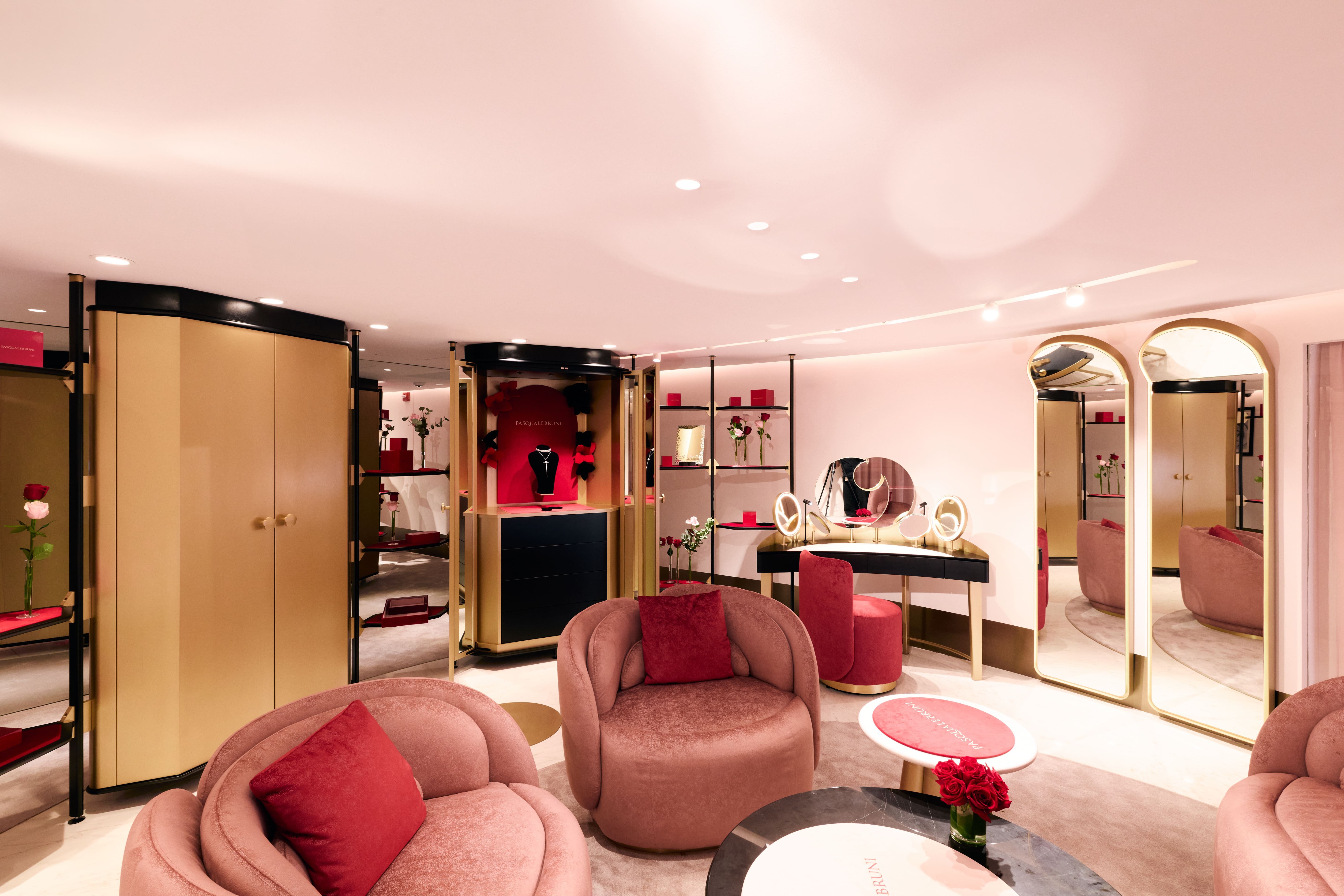 Luxurious, modern interior with pink furniture and elegant decor.