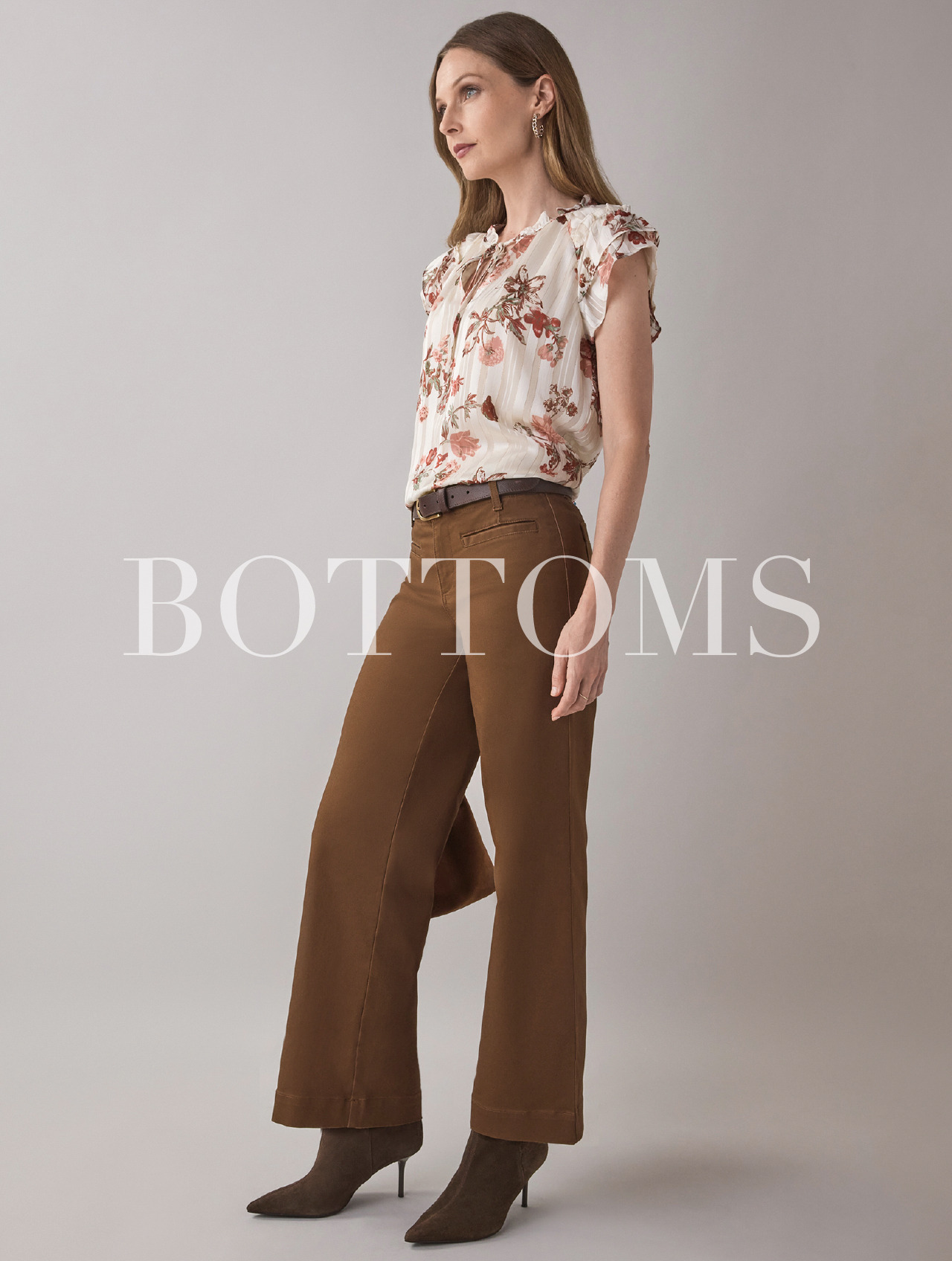 Woman wearing a floral top and brown wide-leg pants, text reads 