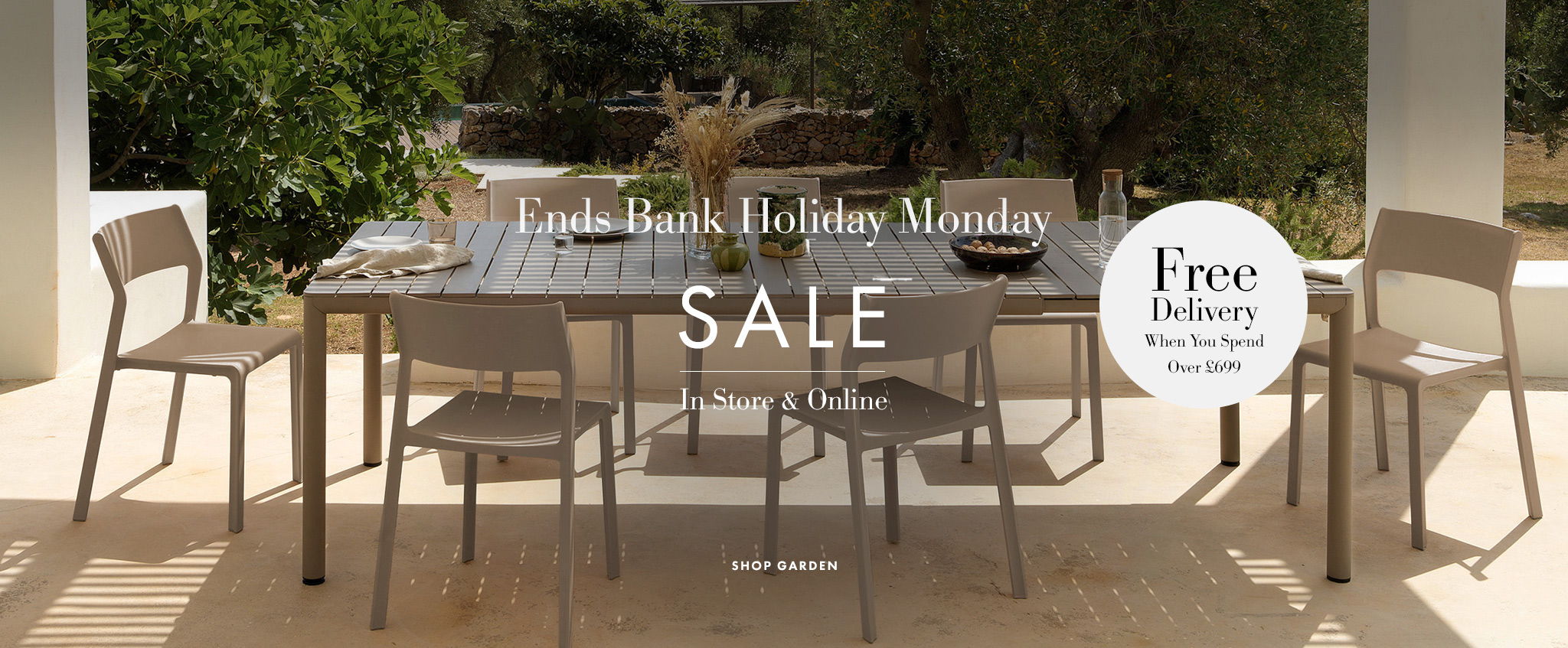 Outdoor dining set with chairs, promoting a sale and free delivery.