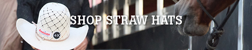 Shop straw hats with a cowboy hat and horse in the background.