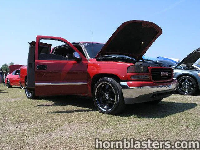 Brandon's red GMC Sierra 1500 Extended Cab exterior overview with Shocker XL train horn install gallery photo 1