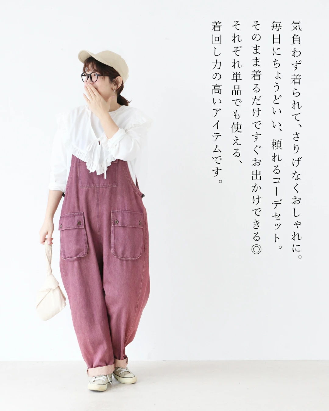 A person in casual attire poses against a plain background.