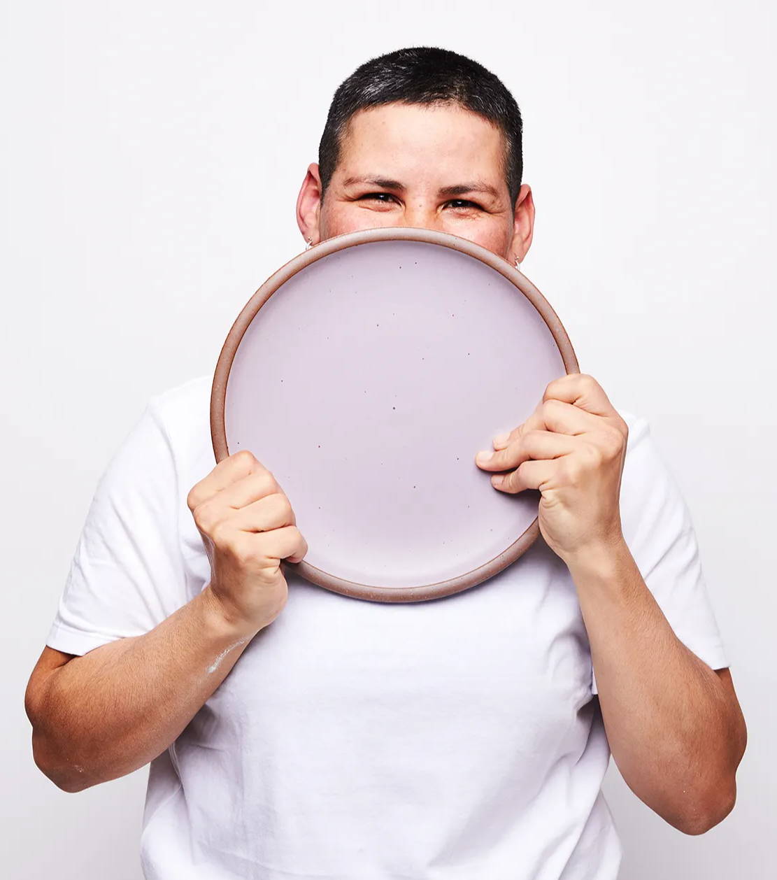 Karla holding an East Fork Dinner Plate in Taro