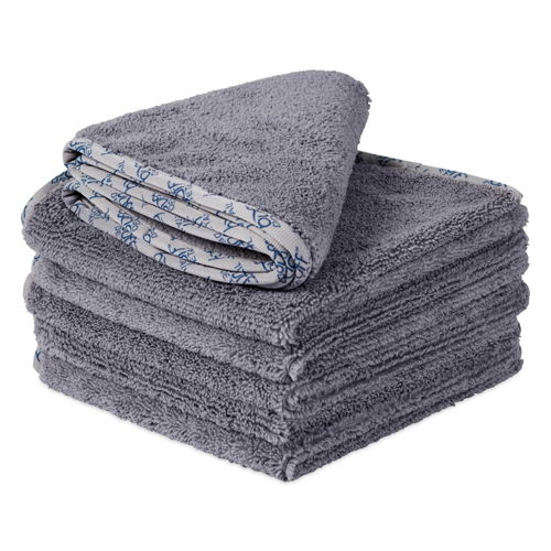 Stack of gray towels with a patterned edge.