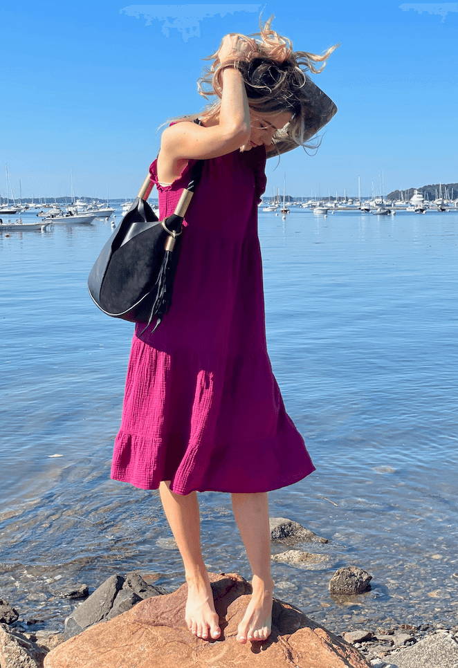 woman holding bag on the beach
