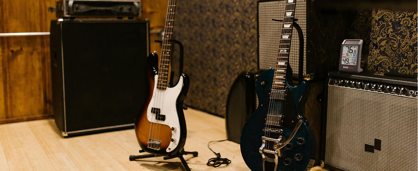 Guitars and amplifiers set up in a music studio.