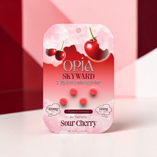 Pack of sour cherry gummies on a colorful background.