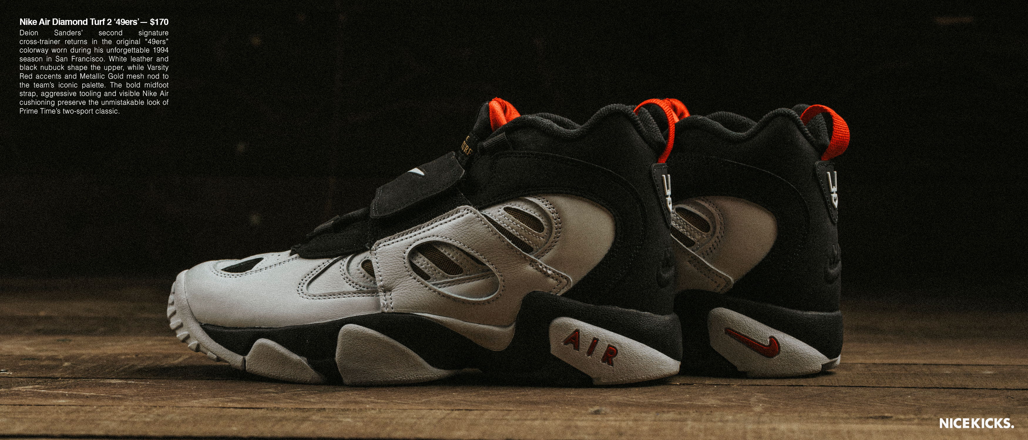 A pair of stylish athletic shoes on a wooden surface.