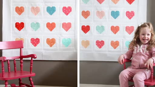 heart quilt with a little girl in a chair