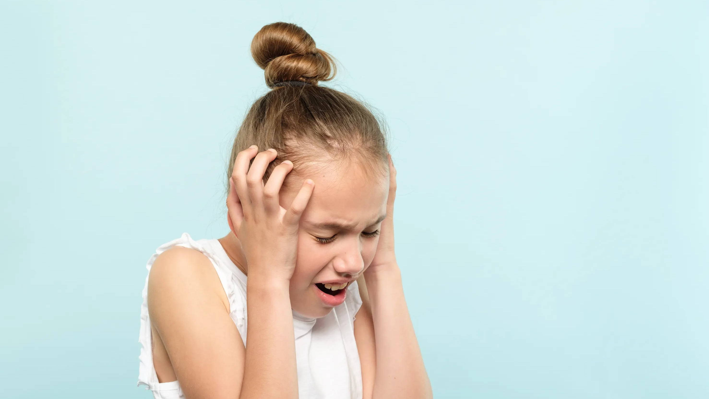 Young girl experiencing sensory overload