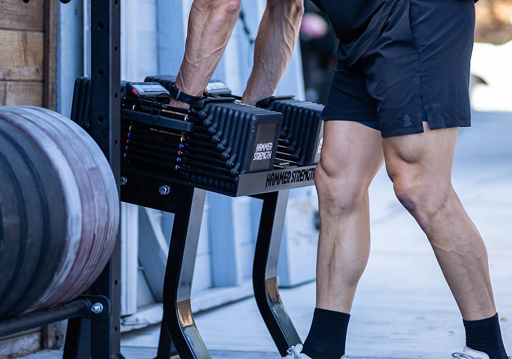 Marcus Filly using Hammer Strength Powerblock Adjustable Dumbbell Stand