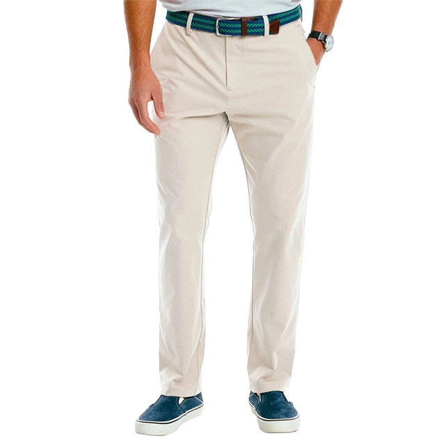 A person wearing beige pants and blue shoes, standing upright.