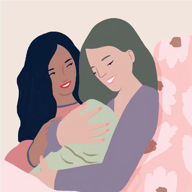 Two women lovingly caring for a baby together.