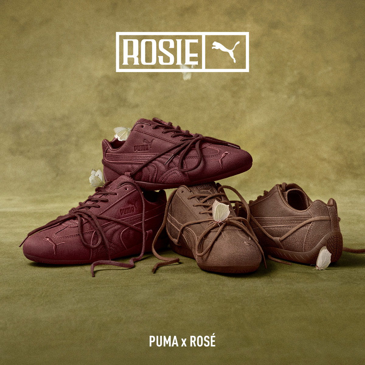 Four pairs of stylish Puma shoes in burgundy and brown tones.