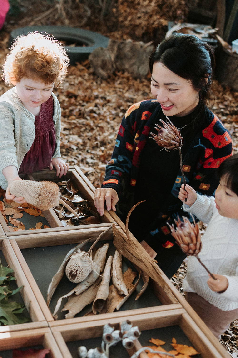 Children Holding Natural Elements from the Sensory Play Table