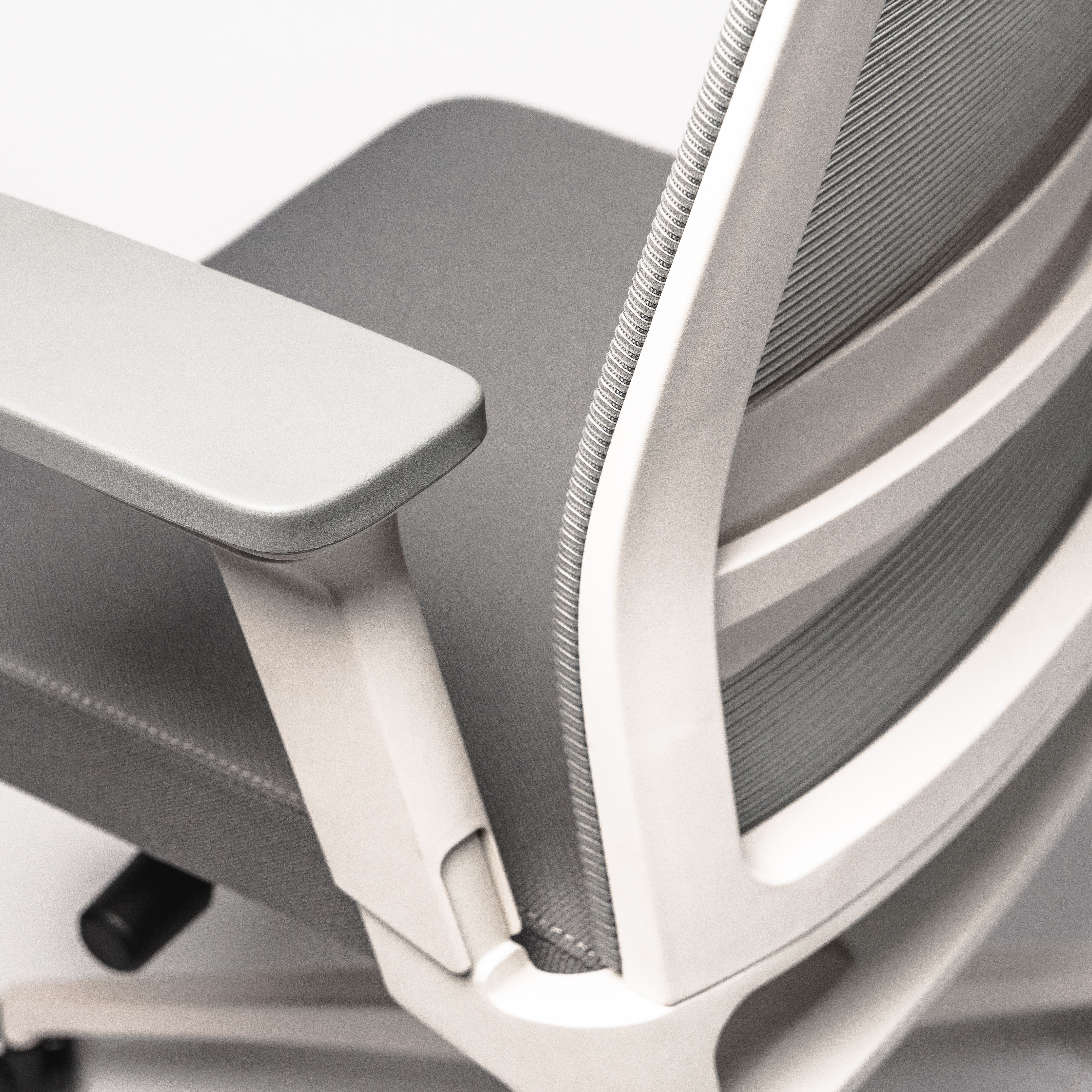 Close-up of an Active " ergonomic office chair Active the back, in an elegant white color