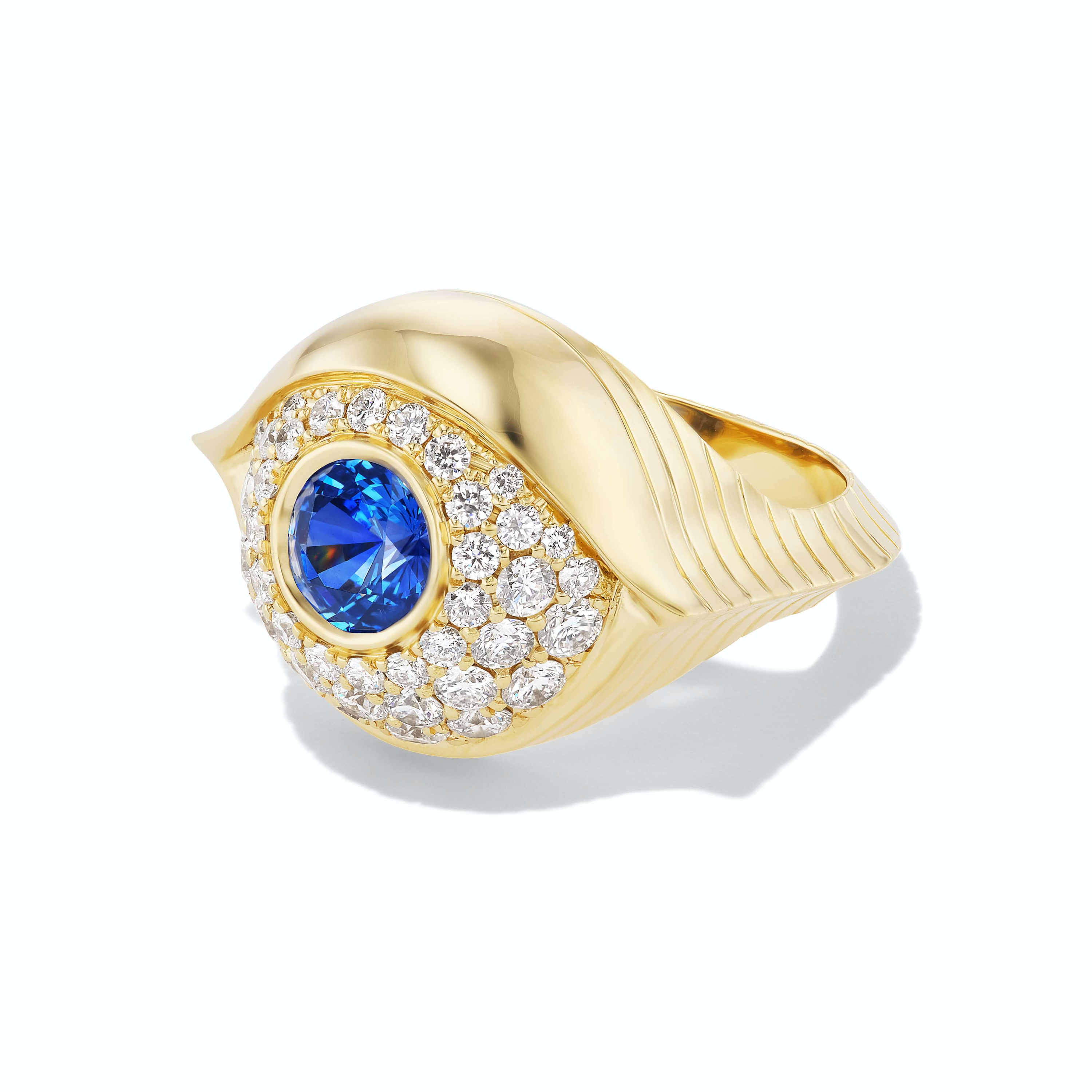 solid gold diamond and blue sapphire evil eye ring