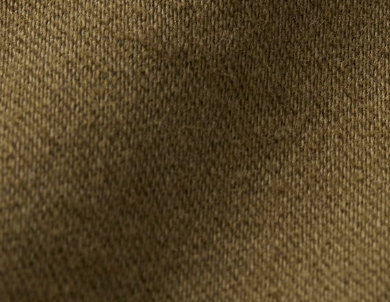 Close-up of a textured brown fabric surface.