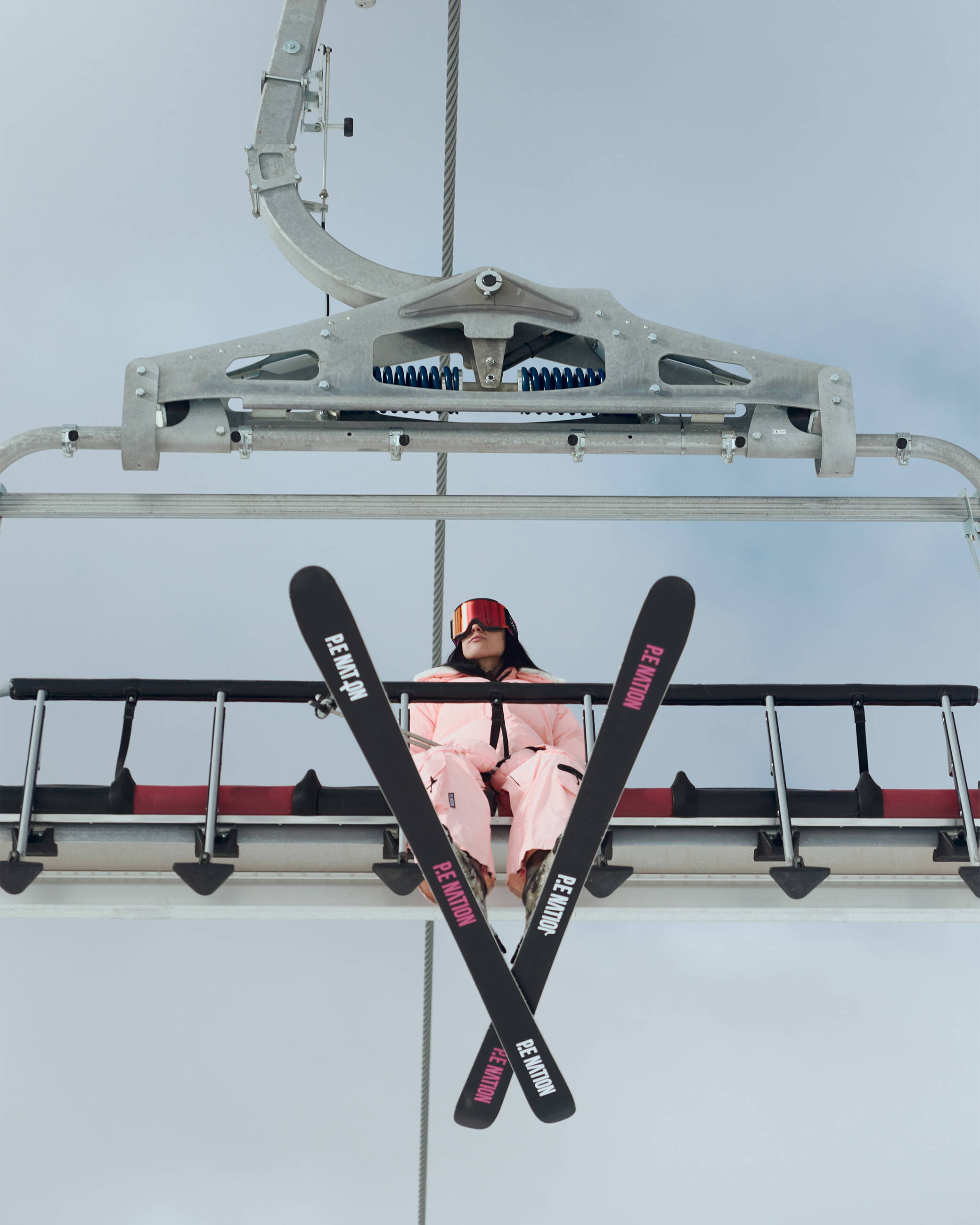 A girl sitting on a ski lift