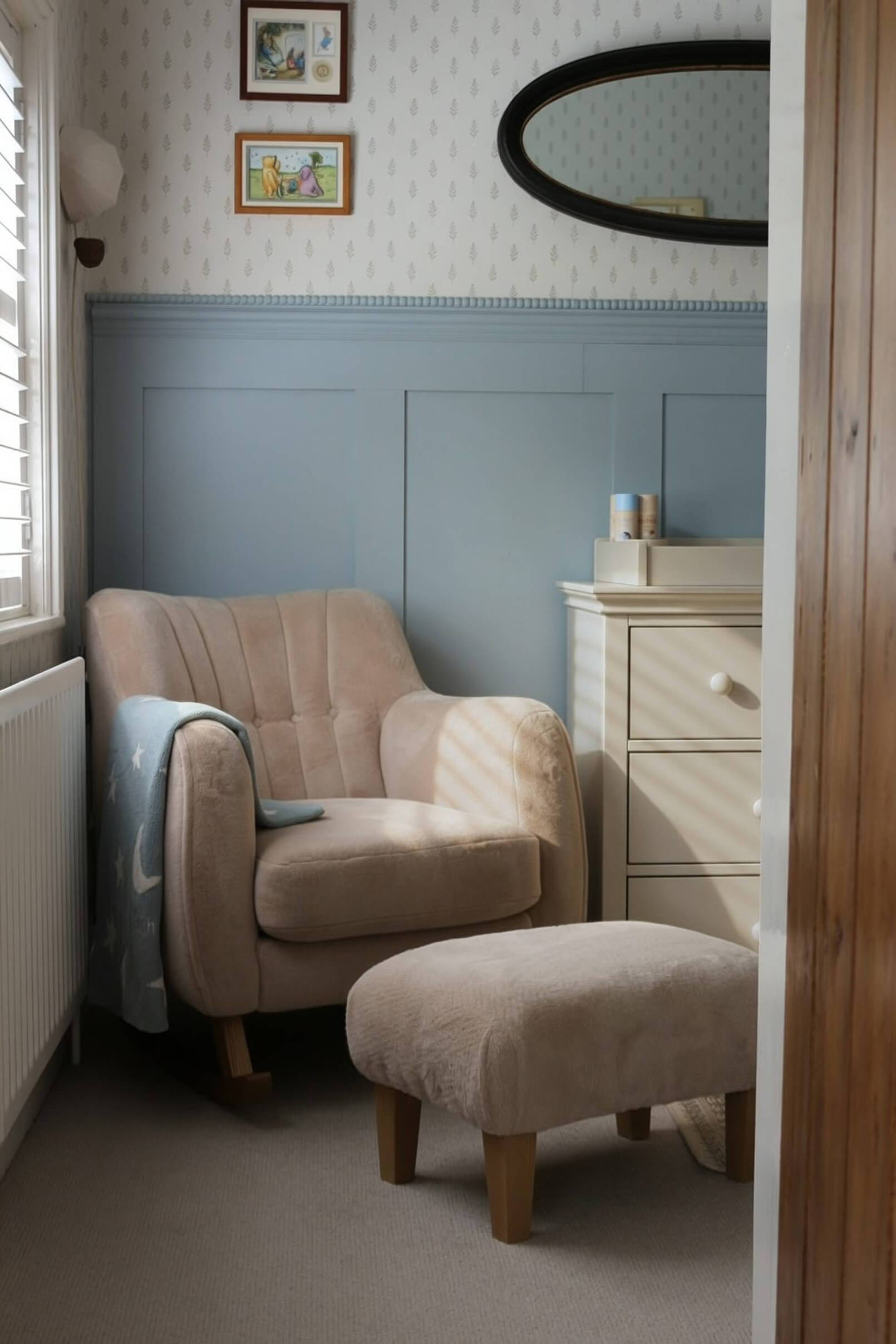 Cozy corner with an armchair, footstool, and dresser in a softly lit room.