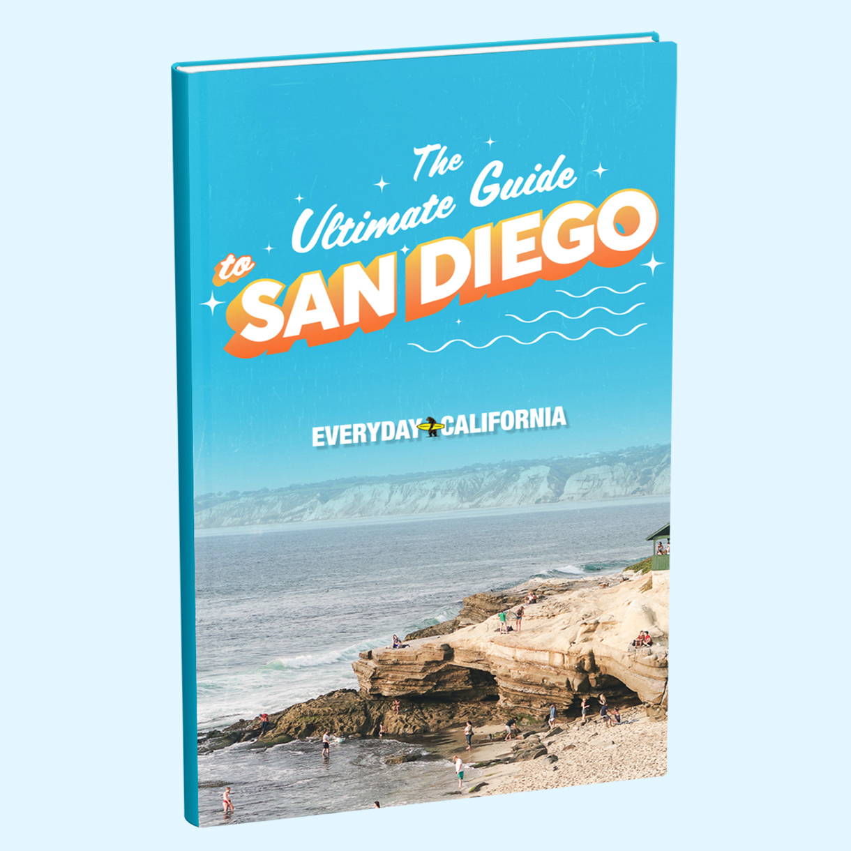 Una imagen de la portada del PDF de la Guía Definitiva de San Diego, que es de color azul brillante y tiene una foto de una playa llena de gente.