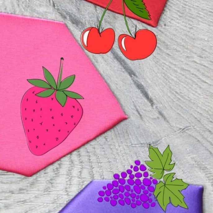 A pink, purple and red solid tie with fruit clip art on top
