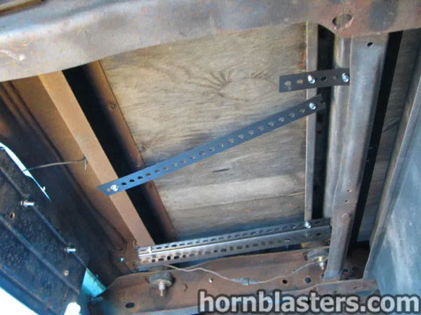 Underside mounting bracket and installation hardware beneath Al's 1967 Chevrolet Suburban 1500, install photo 3