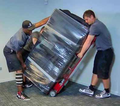 Men moving a gun safe