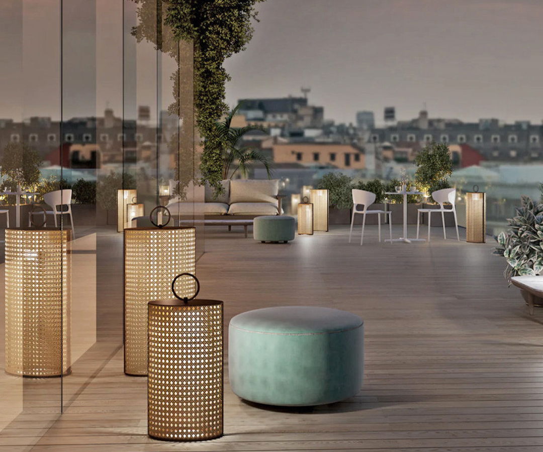 Modern outdoor lounge area with stylish Contardi lighting and city views.