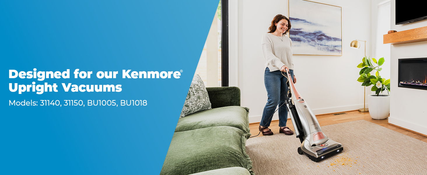 Woman vacuuming a living room with a Kenmore upright vacuum.