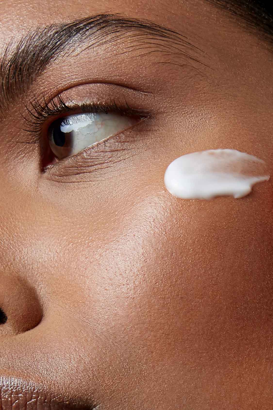 eye cream on model's eye area