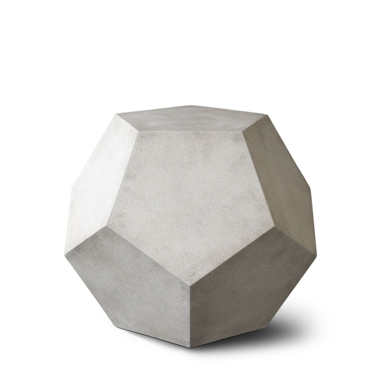 Geometric concrete sculpture with multiple flat surfaces and an angular design.