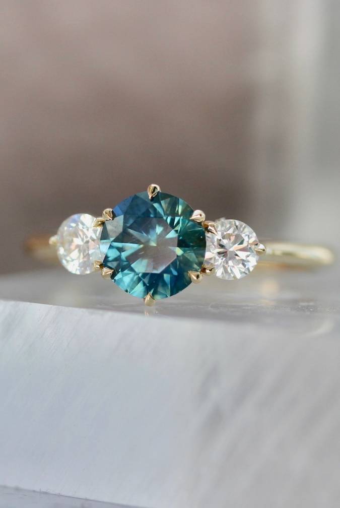 Round Brilliant Sapphire Three Stone Ring With White Diamond Sides