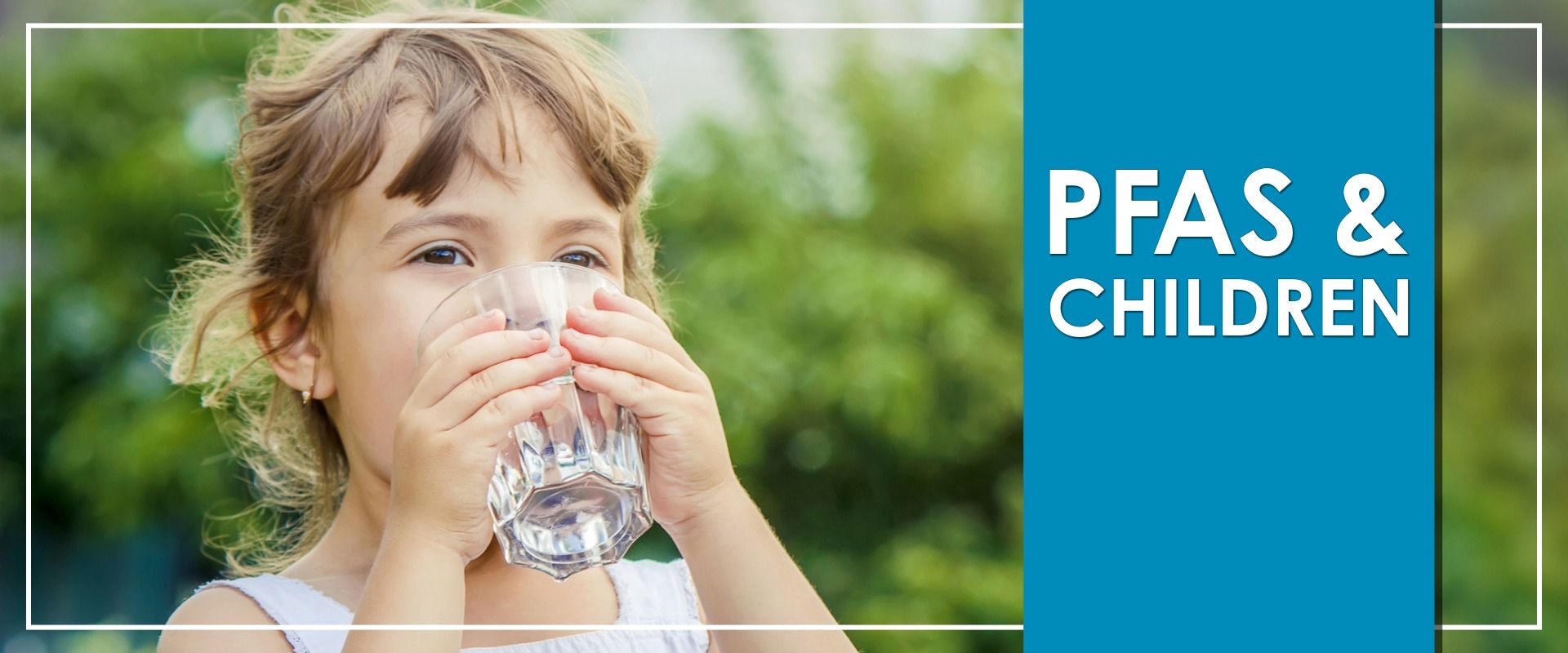 Child Drinking Glass of Water with two hands